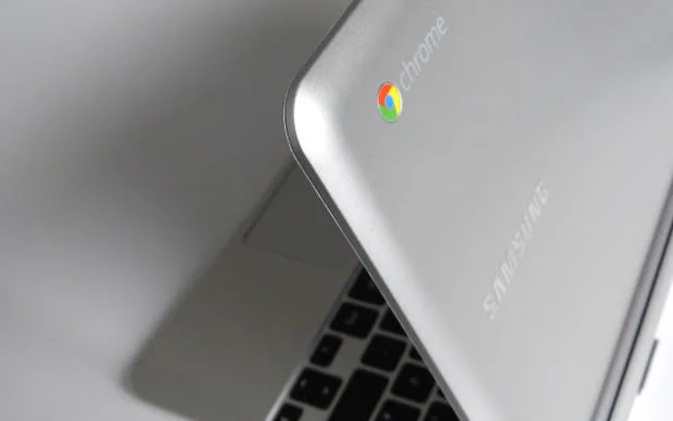 Android apps can now be run on Chromebook Google Chrome logo displayed on the back of a Chromebook