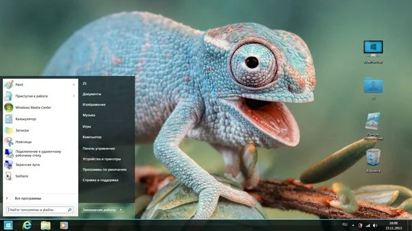 Chameleon perched on a branch against a green background