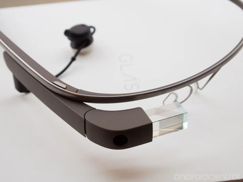 Google Glass headset on a white surface.