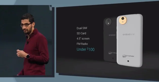 Presenter on stage beside Android One devices