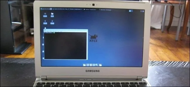 Older compact laptop displaying a desktop interface