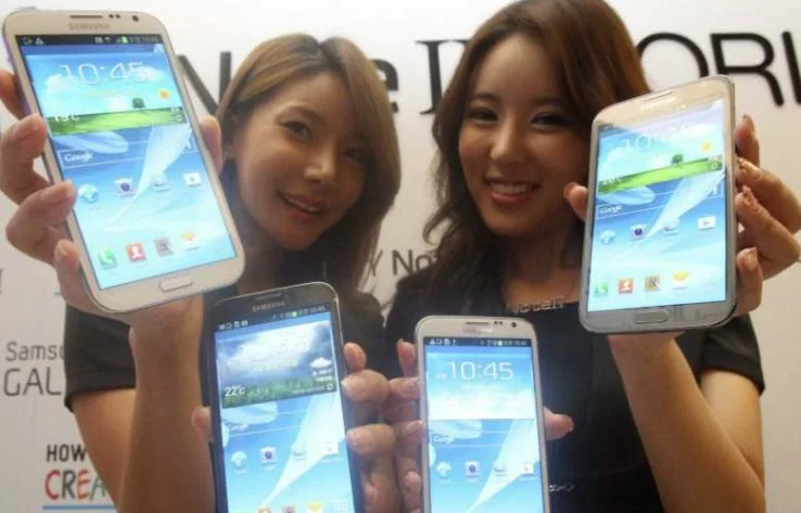 People holding large-screen smartphones.