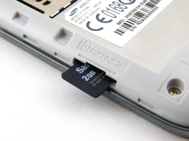 MicroSD card inserted into a phone.