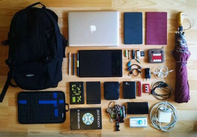 Student desk kit with a backpack, laptop, tablet, notebooks and assorted accessories