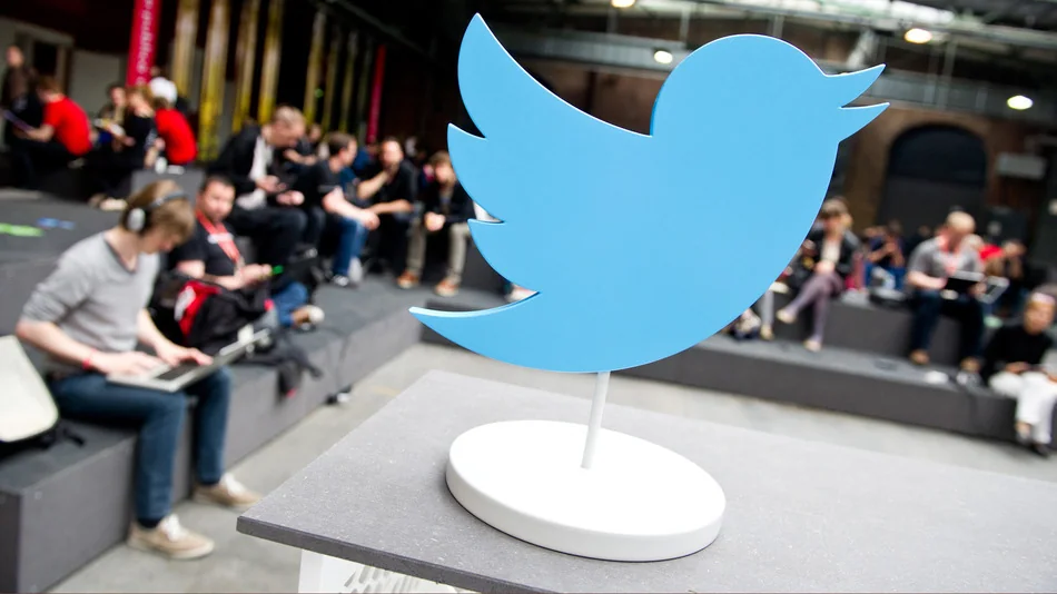 Twitter updates privacy policy to address revenge porn Blue Twitter bird sculpture displayed at a public event